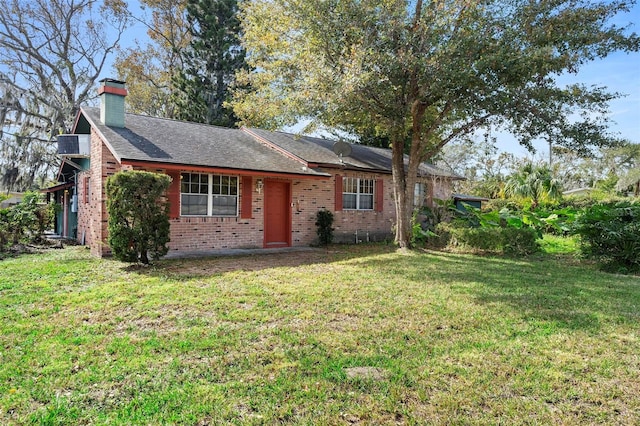 ranch-style house featuring a front lawn