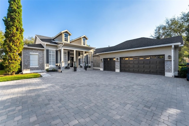 view of front of house featuring a garage and covered porch