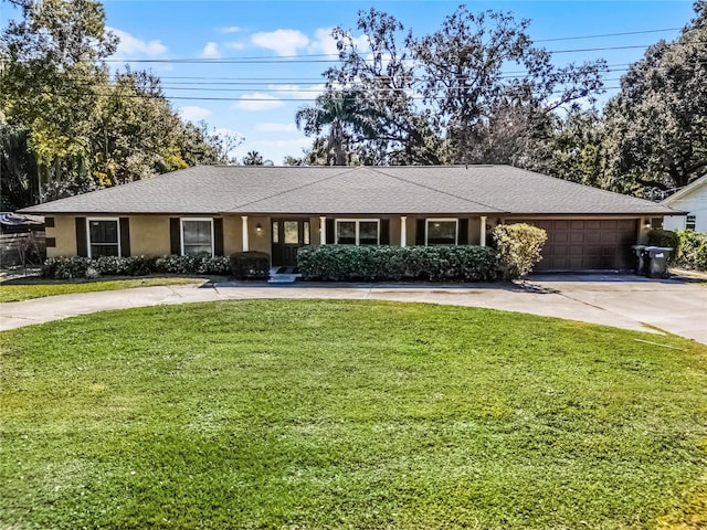 ranch-style house with a garage and a front yard