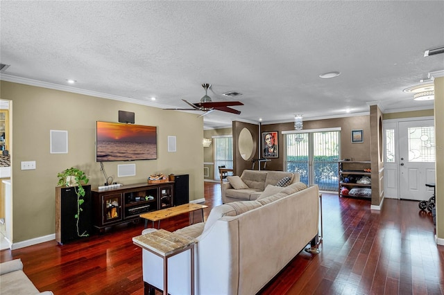 living room featuring crown molding, ceiling fan, dark hardwood / wood-style flooring, and a textured ceiling