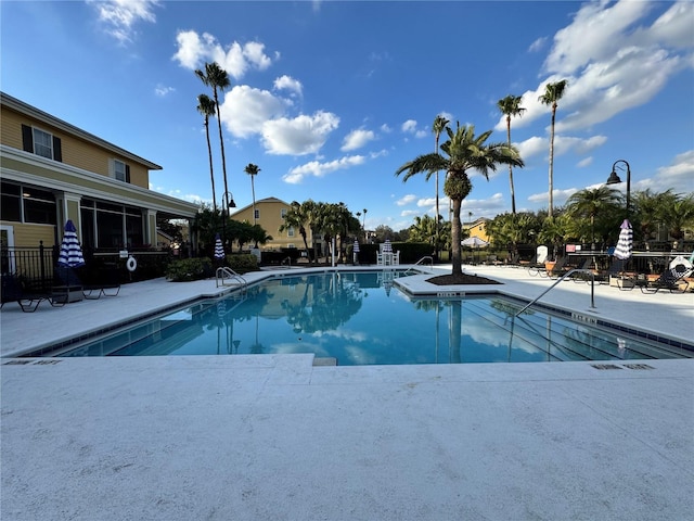 view of swimming pool featuring a patio area