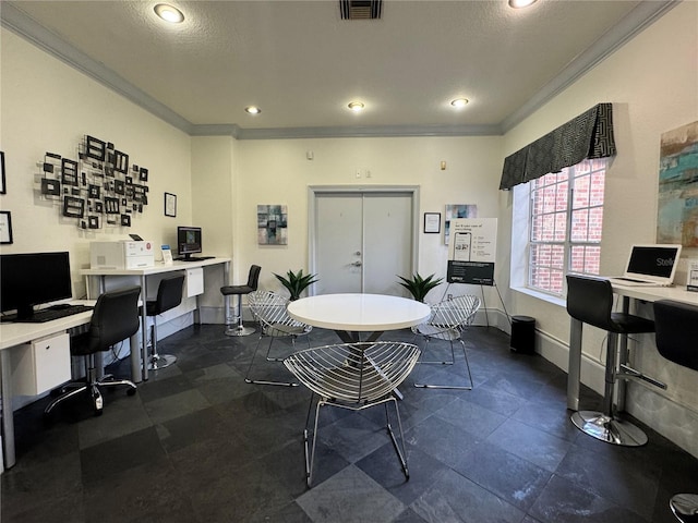 office space featuring crown molding, built in desk, and a textured ceiling