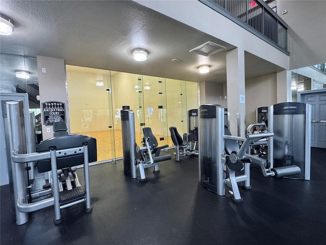 2328 Midtown Ter Unit 1024, Orlando, FL 32839 - workout area with a textured ceiling