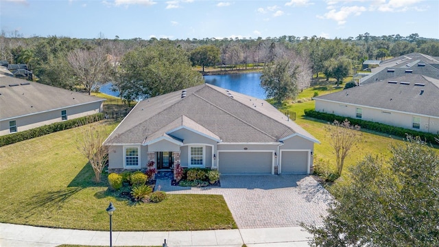 birds eye view of property featuring a water view