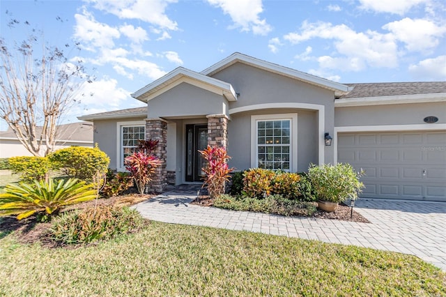 ranch-style house with a garage and a front lawn