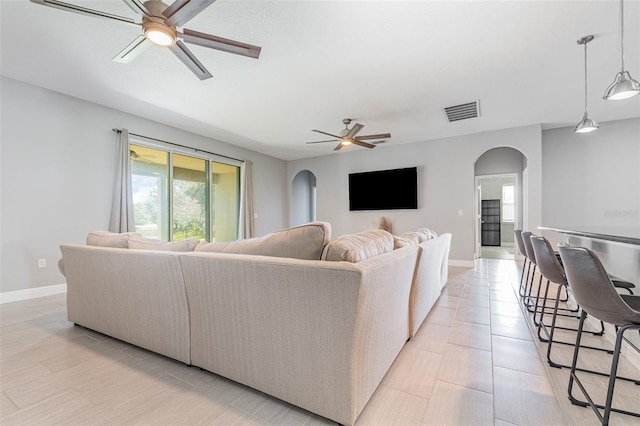 living room with ceiling fan