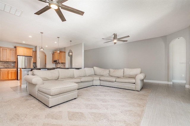 living room featuring ceiling fan