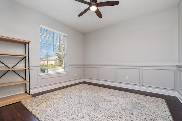 spare room with hardwood / wood-style floors and ceiling fan