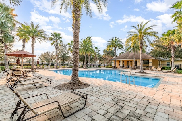 view of swimming pool featuring a patio