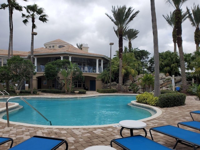 view of pool featuring a patio