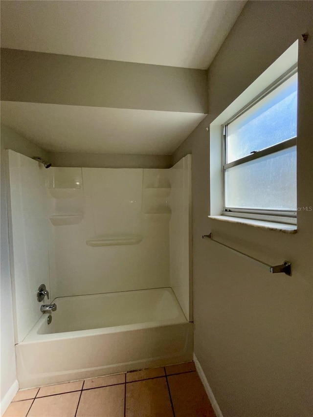 bathroom with shower / washtub combination and tile patterned floors