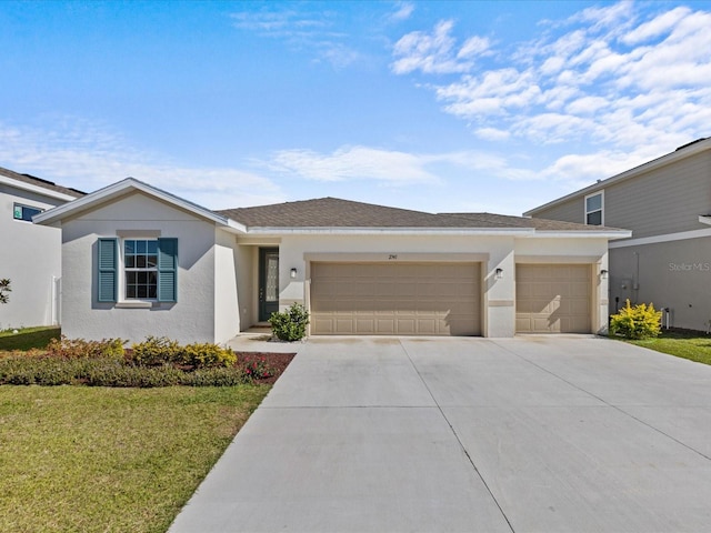 view of front of home featuring a garage and a front yard