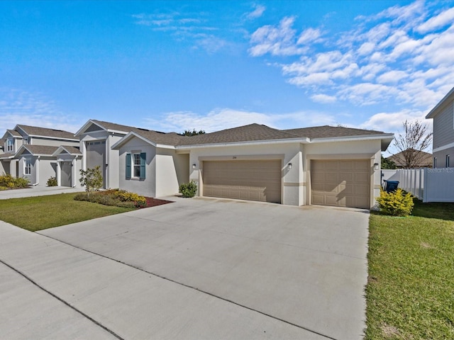 view of front of property with a garage and a front lawn