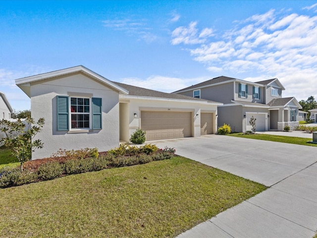 view of front of house featuring a garage and a front yard