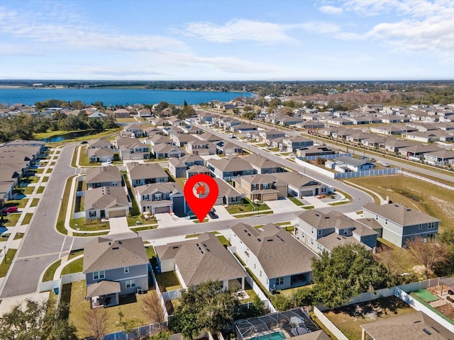 birds eye view of property featuring a water view