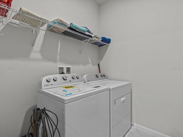 laundry room with separate washer and dryer