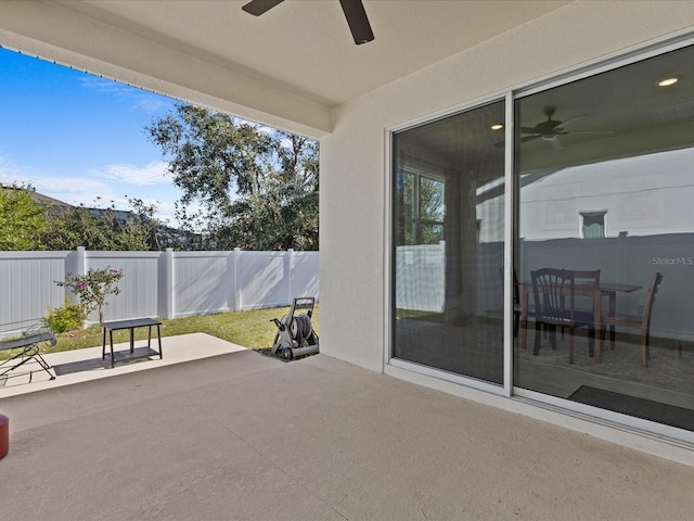 view of patio / terrace featuring ceiling fan