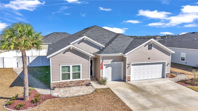 view of front of property with a garage