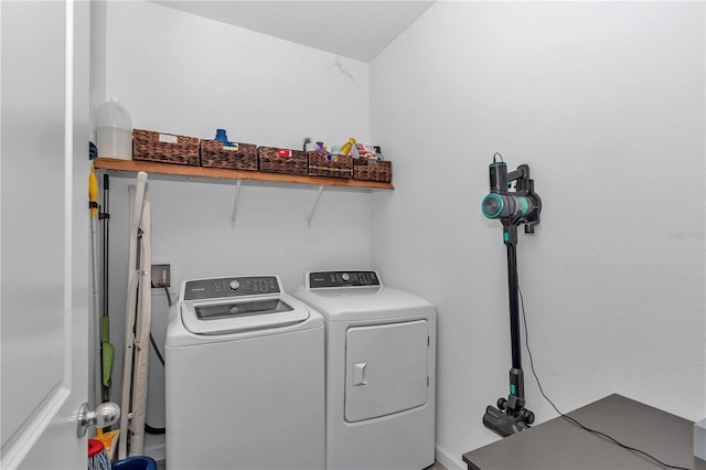 laundry room featuring washing machine and dryer