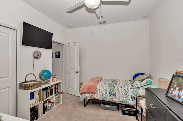 carpeted bedroom with ceiling fan