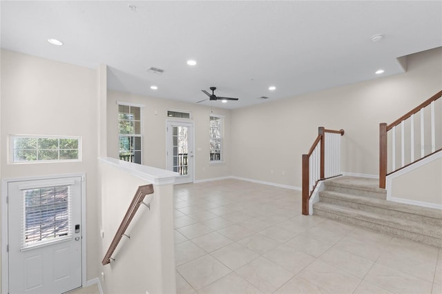 entrance foyer with light tile patterned floors, plenty of natural light, and ceiling fan