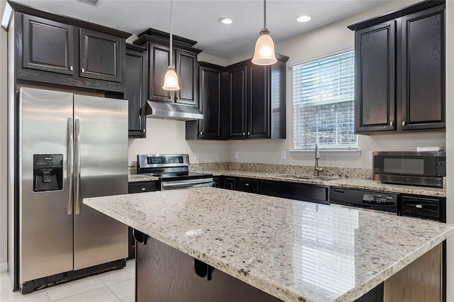 kitchen featuring pendant lighting, sink, a center island, light tile patterned floors, and stainless steel appliances