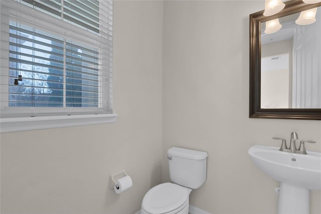 bathroom featuring sink and toilet