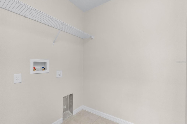 laundry area featuring washer hookup, hookup for an electric dryer, and light tile patterned floors