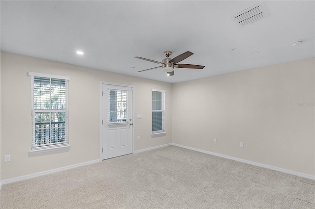 carpeted empty room with ceiling fan