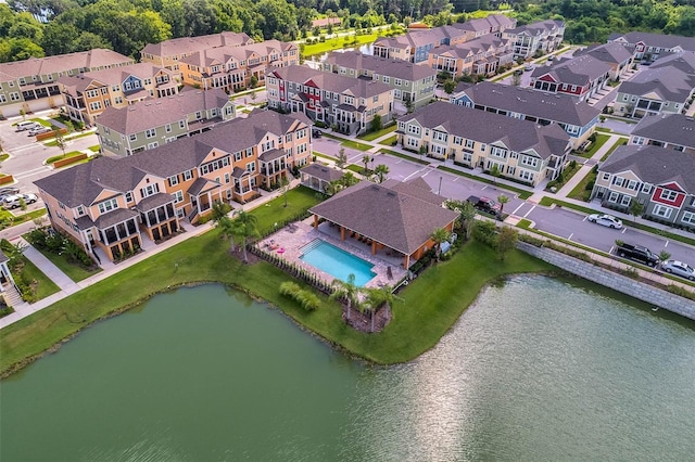 birds eye view of property with a water view