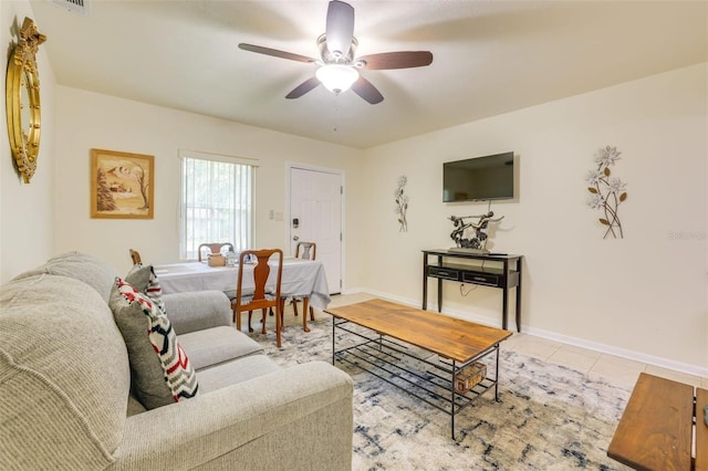 living room with light tile patterned floors and ceiling fan