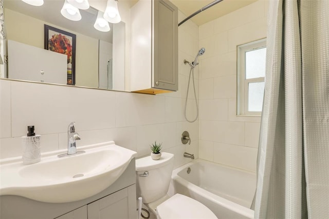 full bathroom featuring tile walls, backsplash, vanity, toilet, and shower / bath combo with shower curtain