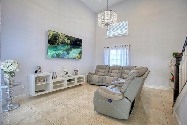 living room featuring a high ceiling, light tile patterned floors, and a notable chandelier