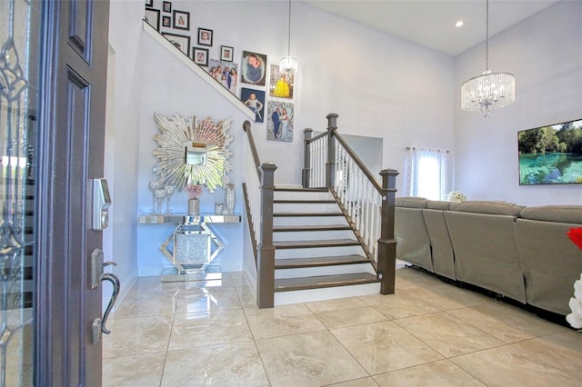 entrance foyer with a high ceiling and a notable chandelier