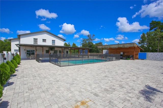 view of swimming pool with a patio area