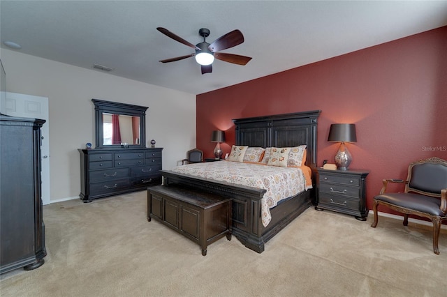 bedroom with light colored carpet and ceiling fan