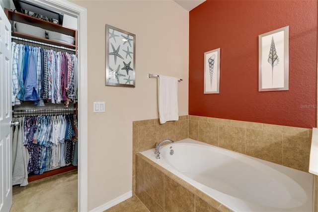 bathroom featuring a relaxing tiled tub