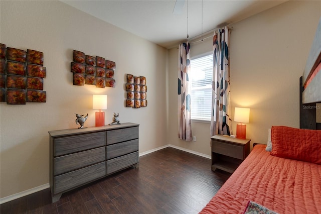 bedroom with dark wood-type flooring