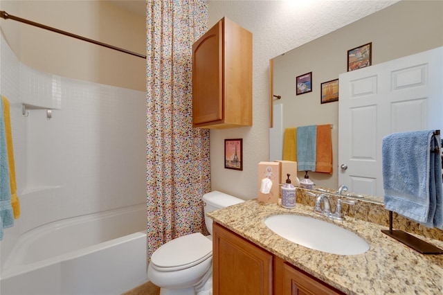 full bathroom with vanity, shower / bath combo, and toilet