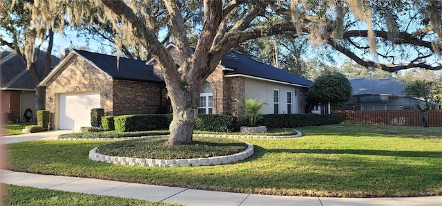 view of front of home featuring a garage and a front yard