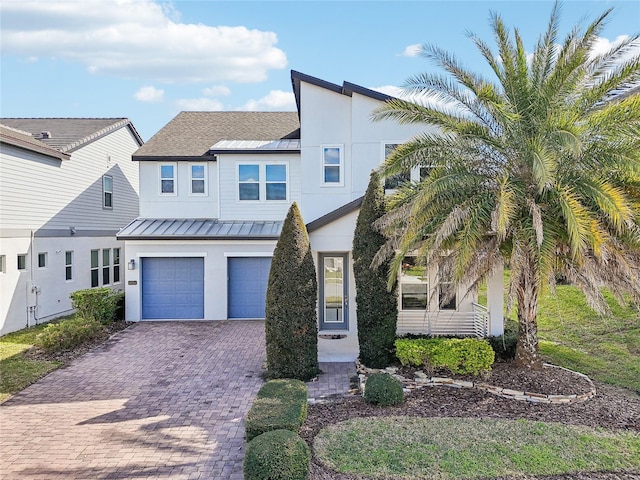 view of front of property featuring a garage