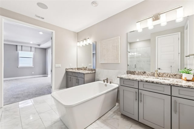 bathroom featuring vanity and plus walk in shower