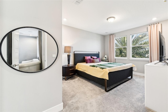 bedroom featuring light colored carpet