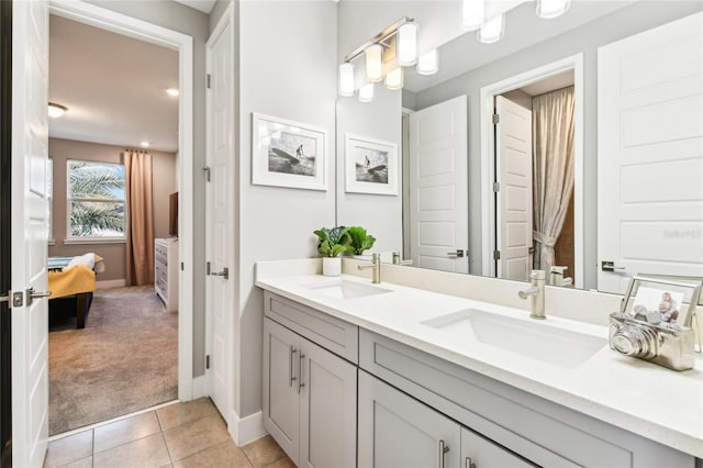 bathroom featuring tile patterned flooring and vanity