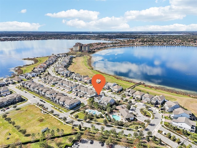 birds eye view of property with a water view