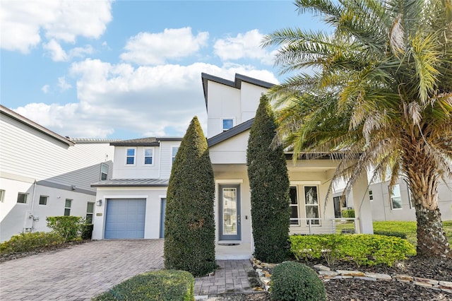 view of front of property with a garage