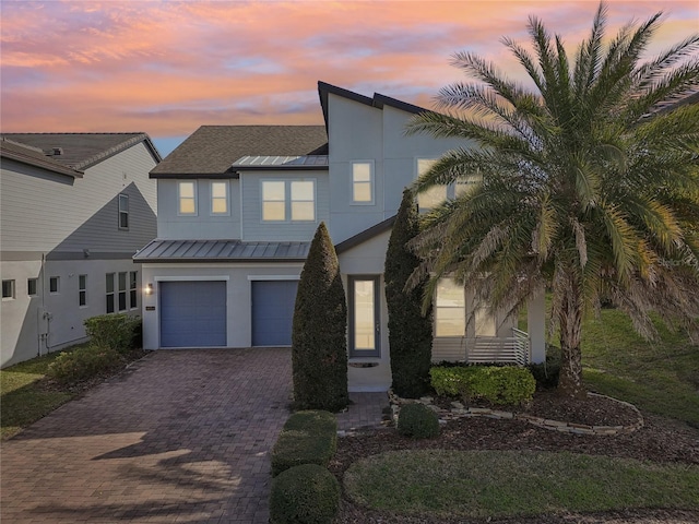 view of front of property featuring a garage