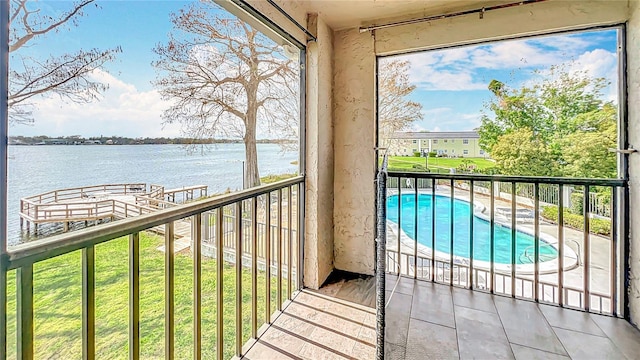 balcony featuring a water view