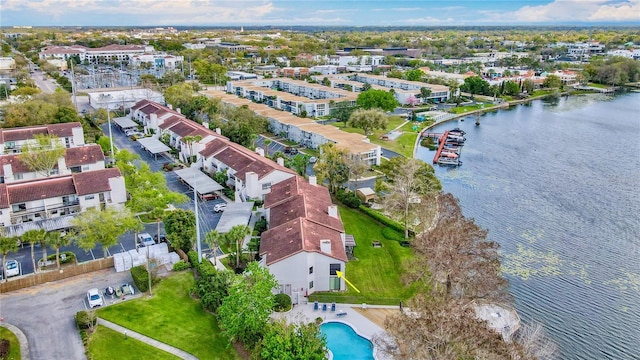 birds eye view of property featuring a water view and a residential view