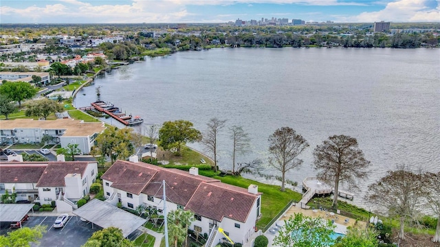 drone / aerial view with a water view and a residential view